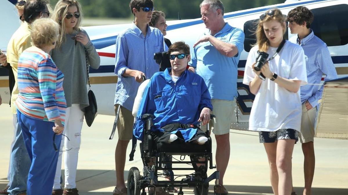 John Harrison Doucet is surrounded by family after arriving home to Gulfport on Tuesday, April 4, 2017.