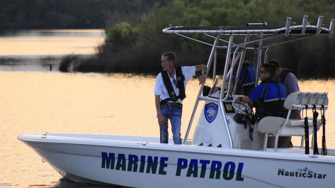 Harrison County Coroner Gary Hargrove accompanies DMR officers to inspect the location of where a body washed ashore near Bayou Bernard on Tuesday, Sept. 27, 2016.