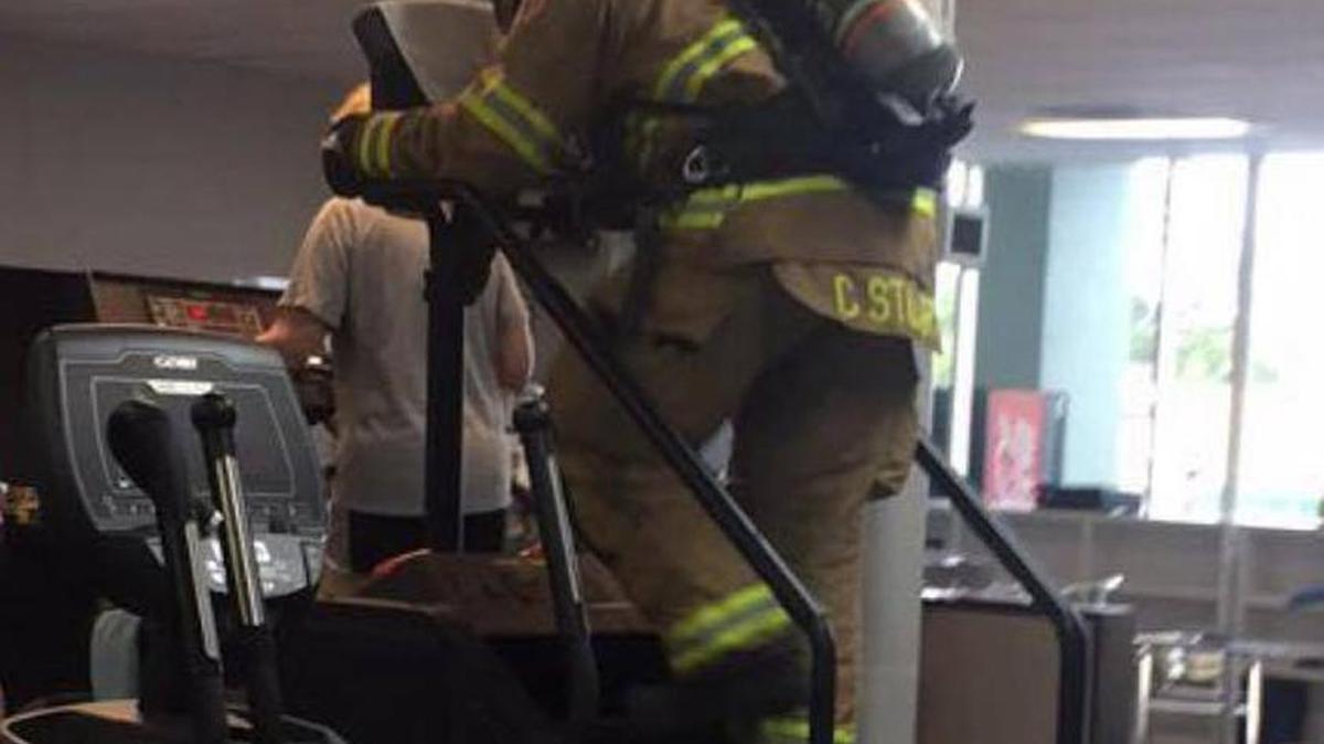 Gulfport firefighter Collin Stuart climbed 110 flights of stairs on a piece of gym eqipument at Rhodes Fitness Monday to remember the firefighters who lost their lives on Sept. 11, 2001.