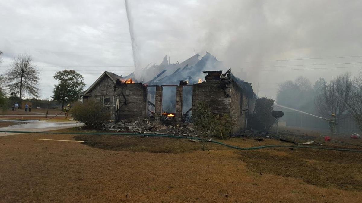 A fire that started in a garage of this home in the Swan Lake subdivision engulfed the residence on Sunday, Jan. 15, 2017.