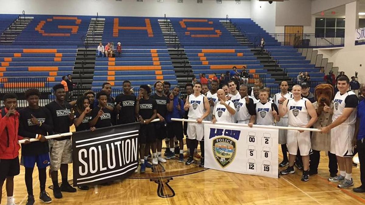 The Blue Crew and The Solution are shown at Gulfport High School, where police officers and students played against each other in a basketball game in December. The Blue Crew will host a game Thursday night at Gulfport High, with Gulfport police and high school students challenging D’Iberville police and high school students.