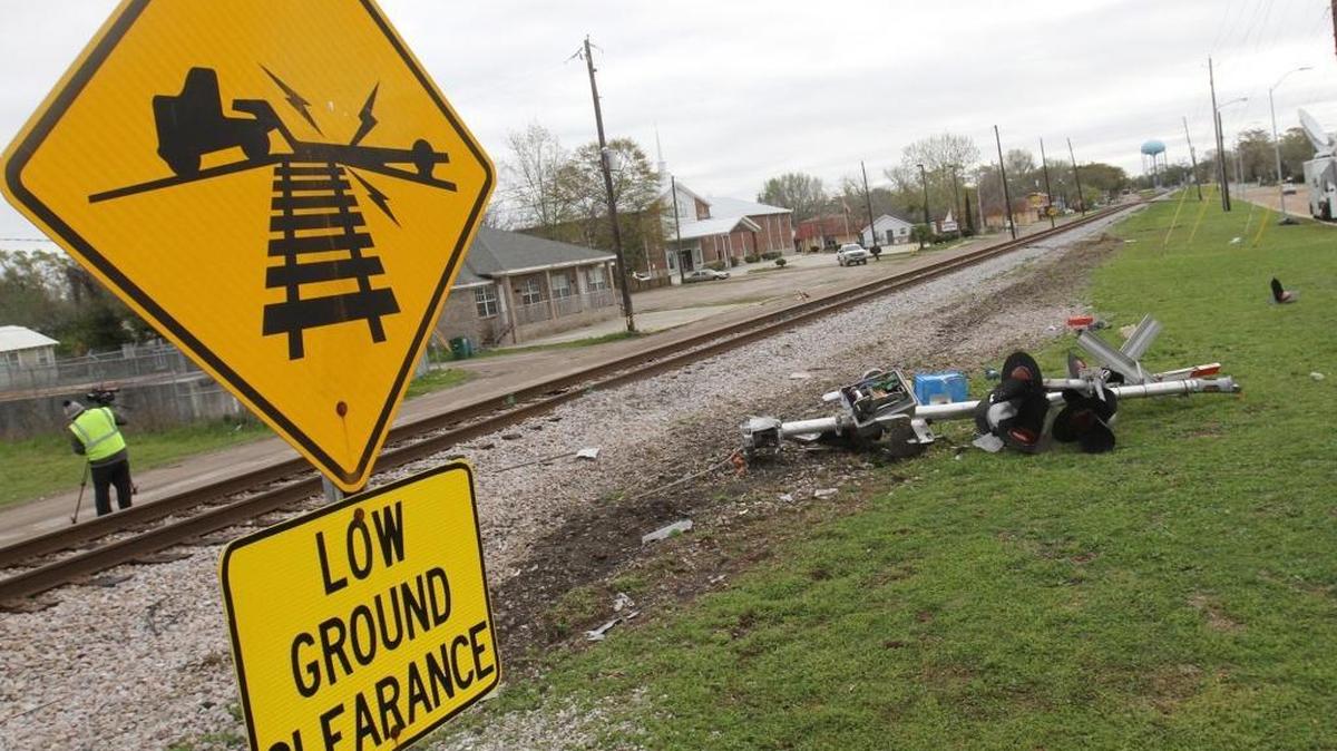 Debris from the railroad crossing signal litters the north side of the railroad tracks on Wednesday, March 8, 2017 near the scene of Tuesday's fatal train-bus wreck at the Main Street railroad crossing in Biloxi.