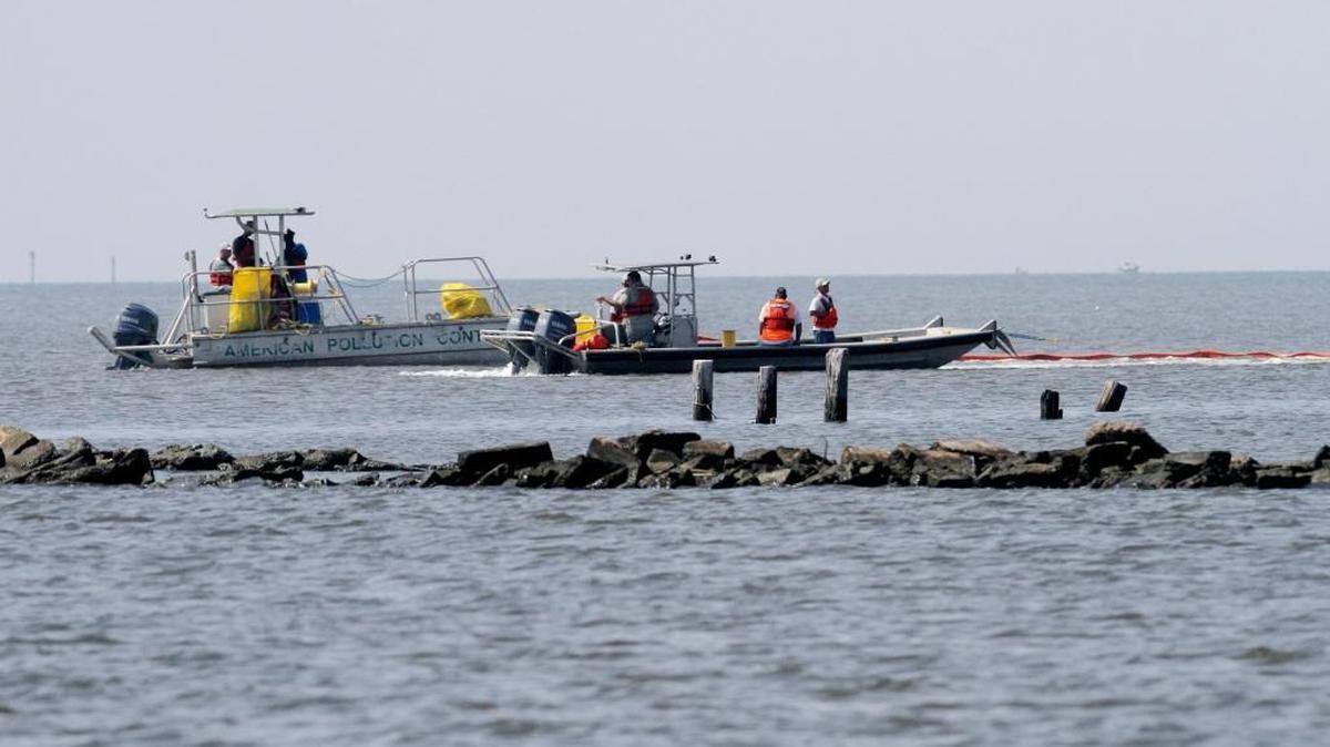 Contractors oversee protective boom at Deer Island off the coast of Biloxi as they look to protect the island from possible effects from the oil spill in 2010. Biloxi Council on Tuesday, Aug. 23, 2016, agreed to join a class action suit for a potential claim against Transocean, Halliburton and others.