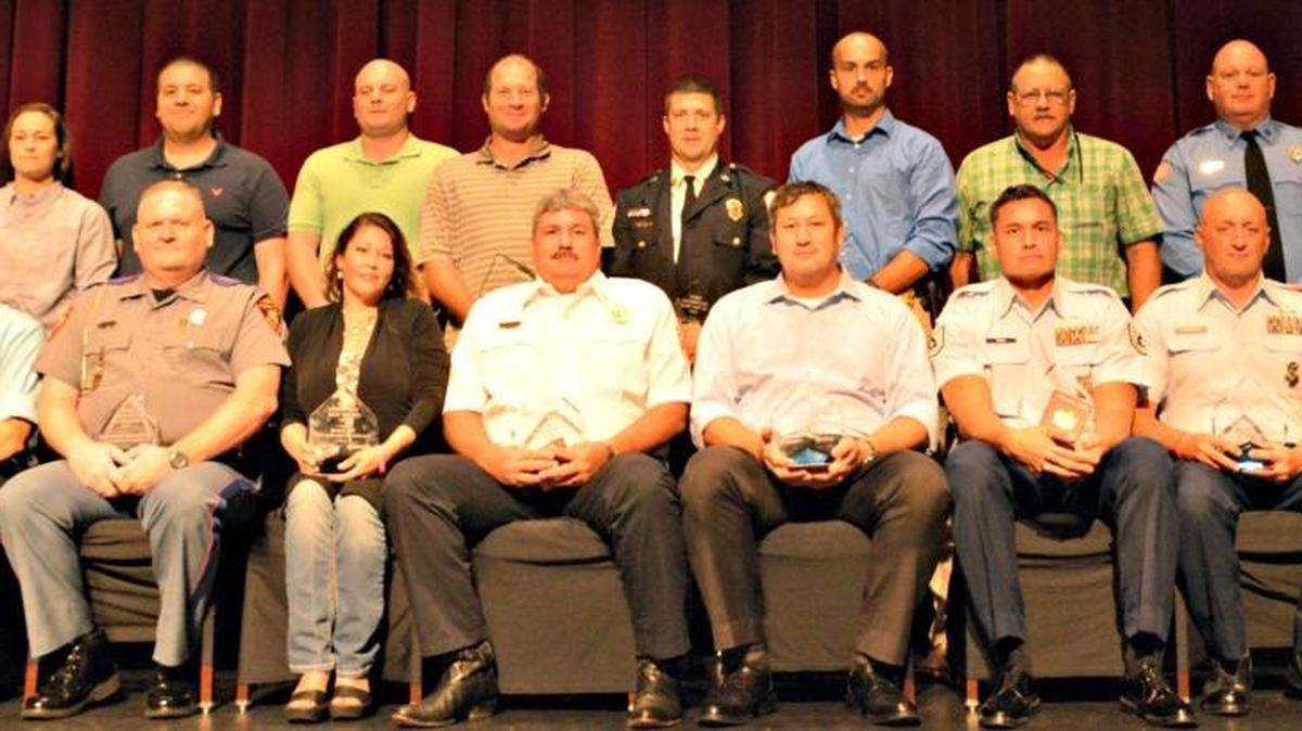 Honored at the Harrison County First Responders Appreciation Dinner are, front row from left: Long Beach Police Detective Brad Gross; Captain Pat Green, accepting for Mississippi Highway Patrol Trooper First Class Demetrious Hawthorne; Pass Christian Police Administrative Assistant Sue Young, Pass Christian Fire Deputy Chief Michael Bass, Harrison County Sheriff’s Department Narcotics Investigator Robert Drace, Keesler Air Force Base Fire Rescue Tech Sgt. Jeremy Noah, Keesler Air Force Base Security Forces Tech Sgt. Flight Chief Matthew Gormely, Biloxi Fire Chief Joe Boney, accepting for the Biloxi Fire Department. Back Row: AMR Paramedic Jessica Torres, Biloxi Police Patrolman Jeffrey Duffield, D’Iberville Police Patrolman Travis Sorensen, D’Iberville Fire Department Training Officer Joel Mayfield, Gulfport Fire District Chief Matthew Faul, Gulfport Police Detective Clay Fulks, Harrison County Fire Service District Chief Ray Luke, Long Beach Fire Department Driver/Operator Brian Moore.