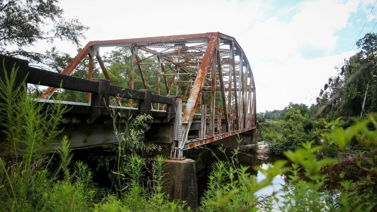 The Mississippi 57 highway bridge over Red Creek was for sale when a tractor trailer rig carrying a track hoe, hit the bridge and took it out. The Mississippi Department of Transportation has wanted to sell it to the public for relocation after a new bridge was built next to it.