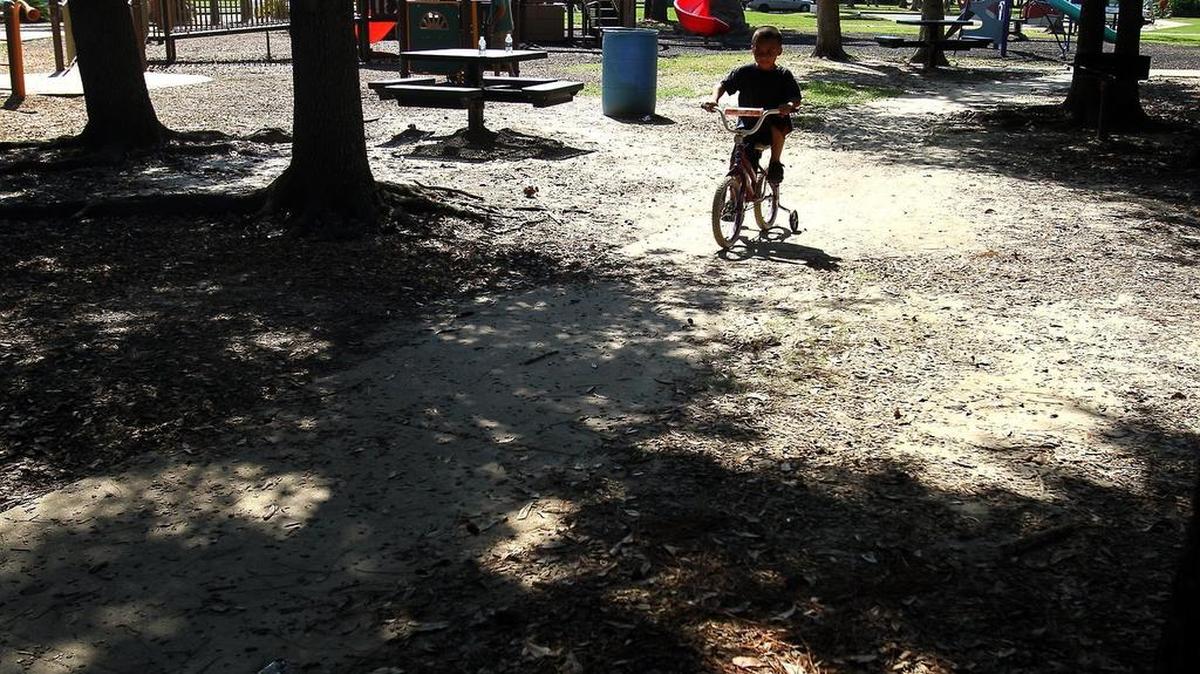 Jose Ocasio, 5, spends a Sunday afternoon riding his bike along the paths of IG Levy Memorial Park in Pascagoula on September 23, 2012.