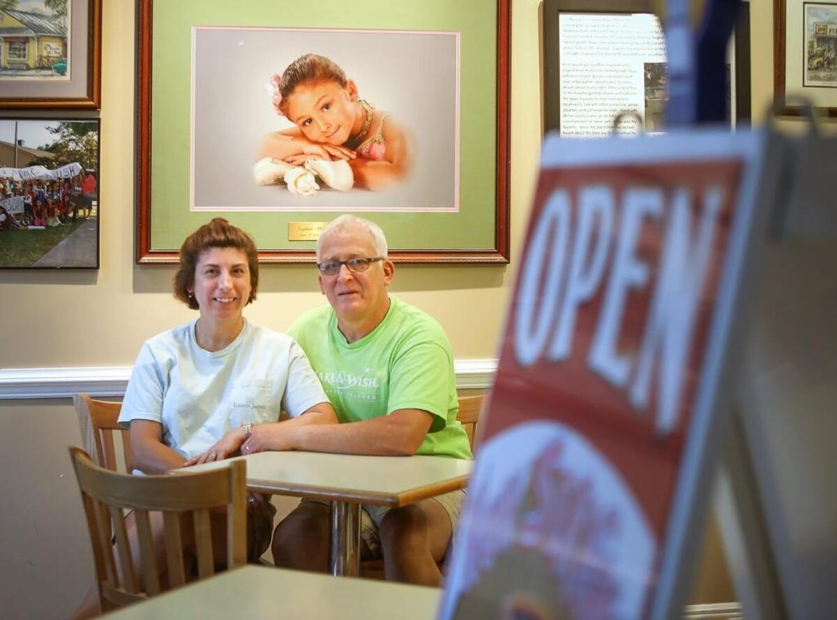 A photograph of Sophia Mohler hangs in a prominent position in David and Theresa Mohler’s downtown Ocean Springs establishment, TatoNut Donut Shop. Mohler was the first of three children in Ocean Springs to be diagnosed with DIPG in August of 2009.