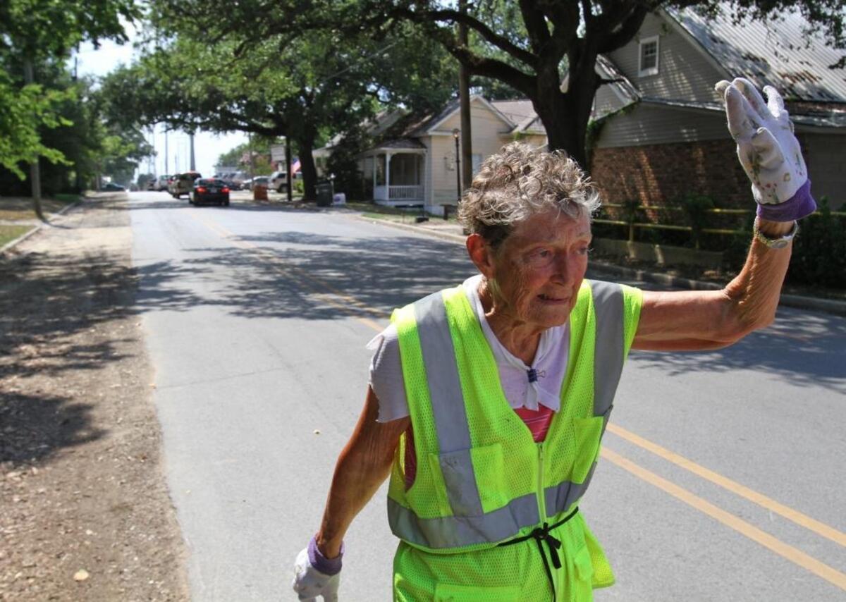 Doris Witchen of Pascagoula waves to a passing motorist as she walks down Live Oak Avenue in Pascagoula in 2011. Witchen was 84 when the Sun Herald did a profile story about her tenacity. She walked every day for 35 years and died at the age of 90 this year.
