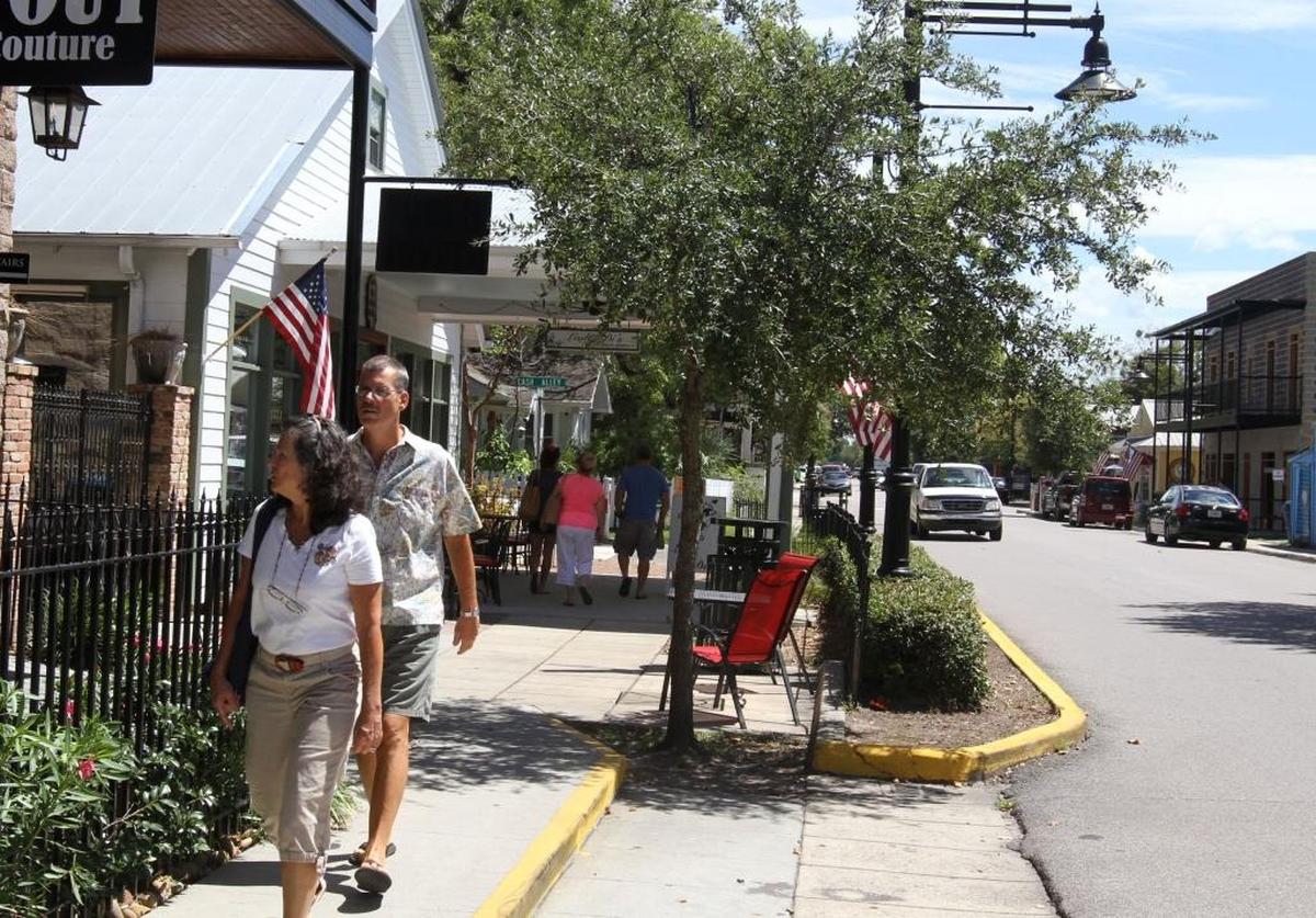 Visitors walk among the restaurants and shops along Government Street in Ocean Springs.