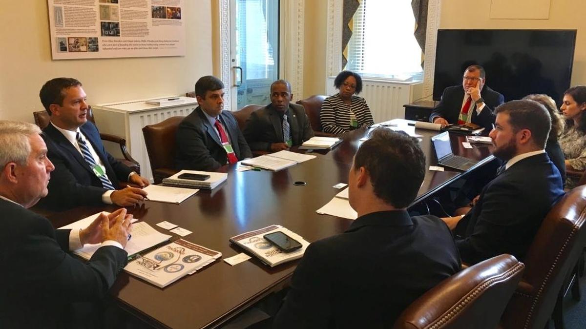 Jackson County leaders build rapport with White House officials on Monday. They are, from left, Gautier Mayor Phil Torjusen, Jackson County Administrator Brian Fulton, County Supervisor Troy Ross and Moss Point Mario King, with Pascagoula Mayor Dane Maxwell at the end of the table, far right.
