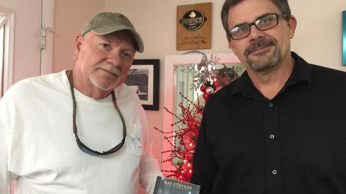 Tommy Crawford and Taylor Craven show off a copy of the new Ray Stevens Christmas album, ‘Mary and Joseph and The Baby and Me.’ The album contains the song they wrote called ‘Claws (A Cat’s Letter To Santa).’