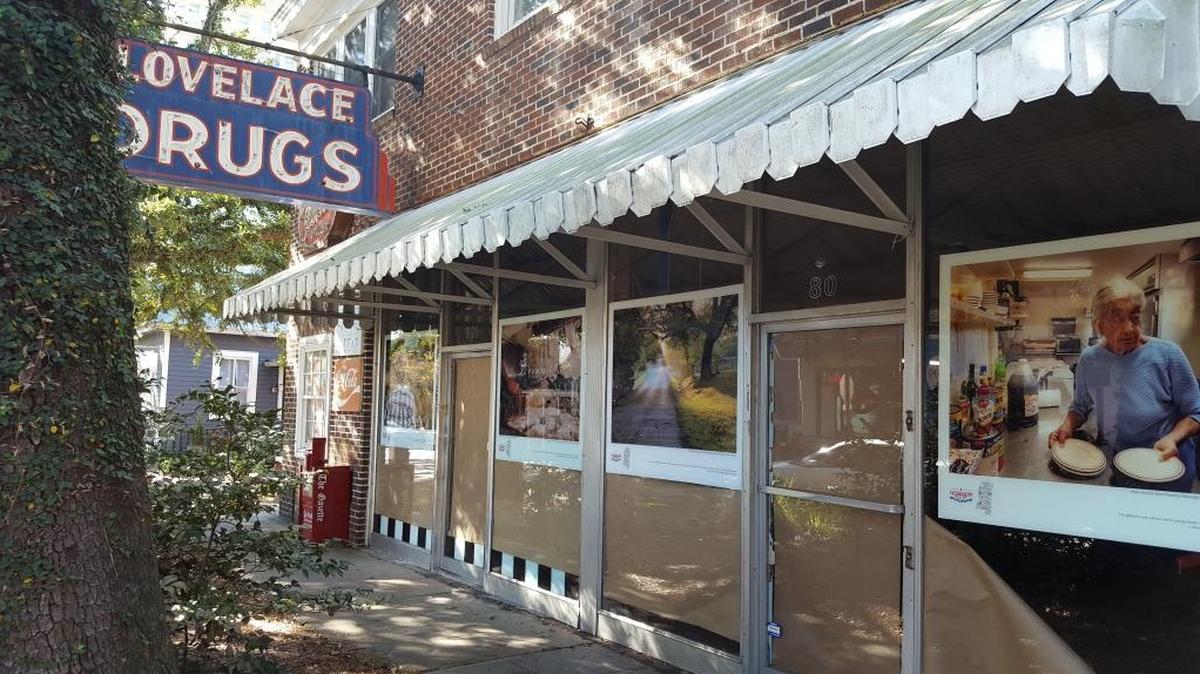 The front of Lovelace Drugs is covered in brown butcher paper and portraits and images from Ocean Springs in honor of the city’s contributions to Mississippi’s 200 years. At right is Joicelyn Mayfield, who used to have Joicelyn’s restaurant on U.S. 90.