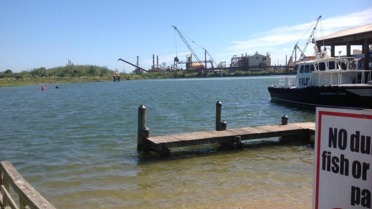The EPA is releasing up to 40 million gallons of partly treated acid water from the gypsum stacks of east Pascagoula to make room for the rain and surge expected with the approaching storm, Nate. The discharge changes the color of the water for about 40 to 50 yards. It’s hard to see in this photo, but the discharge appears on the opposite side of Bayou Casotte as a light colored strip.