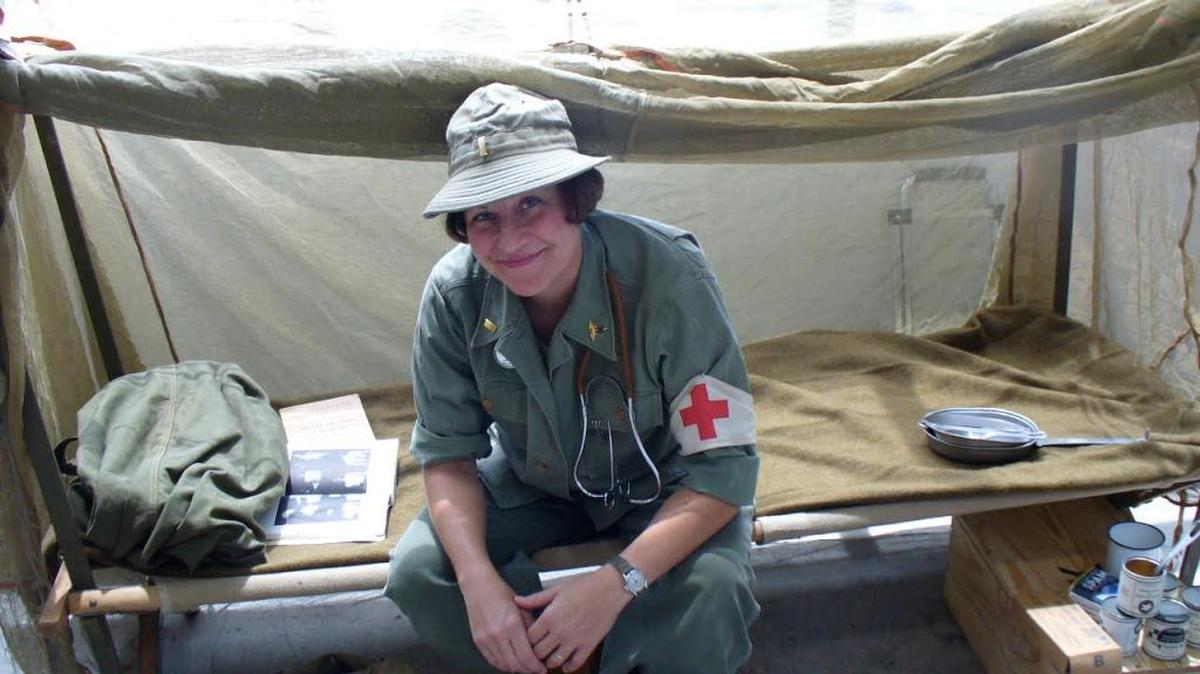 Lauren Pursley has been re-enacting World War II for 17 years, but it has been only in recent years that women were accepted as soldiers. Here she’s volunteering at the National WWII Museum in New Orleans as a medic from that era.