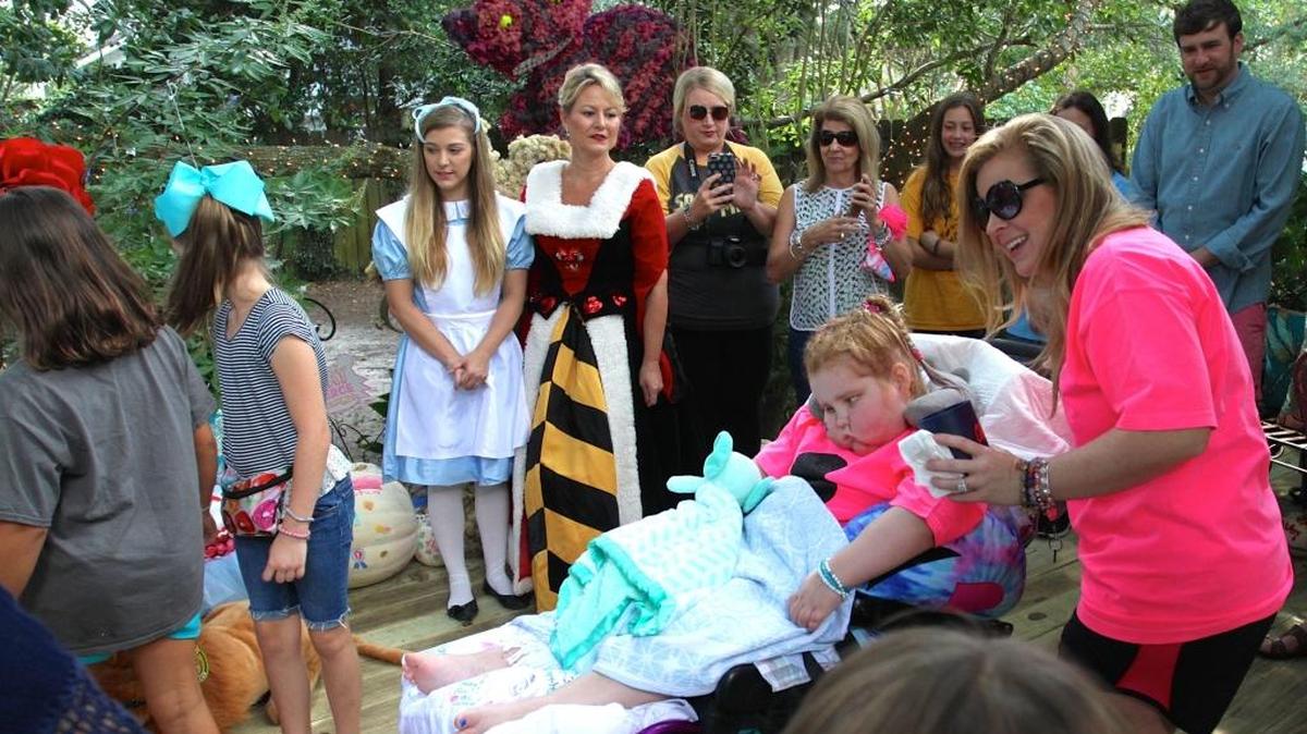 The Queen of Hearts and Alice in Wonderland were among the special guests at the Happy Un-Birthday Party for 7-year-old Sophia Myers, pictured with mom Angel Myers. Sophia is the third child in Ocean Springs diagnosed with a rare brain cancer known as DIPG.