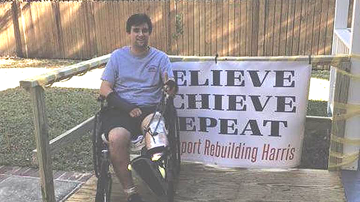 Harris McDonnell goes down the ramp built by volunteers at his mom and dad’s home.