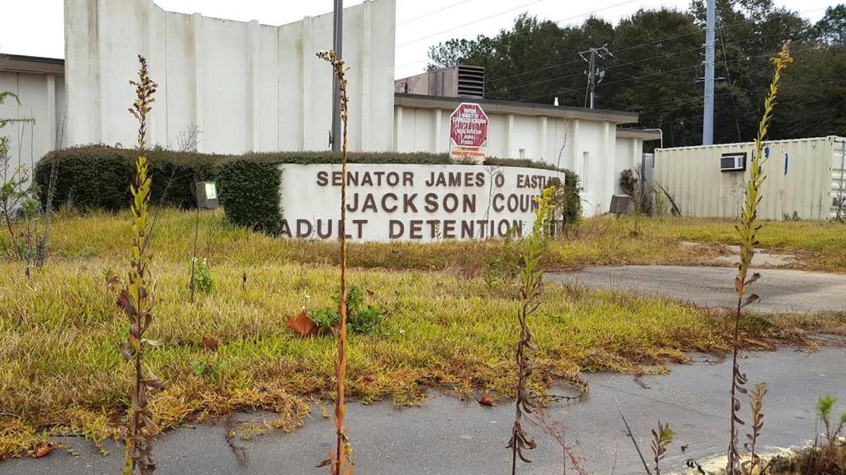The front door is locked and the yard is grown up at the old Jackson County jail. Supervisors decided Monday to start the process of tearing it down — a jail that was overcrowded and tacked onto, but hung on until they could build a new one.