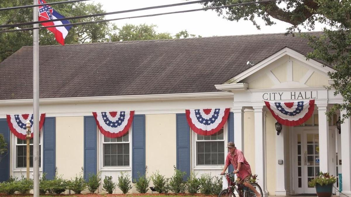The state flag that is flying over City Hall will be taken down by Ocean Springs Mayor Shea Dobson, he said on Facebook.