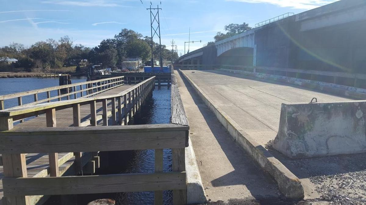 This section of the Old Fort Bayou swing bridge, center, is crowding Jackson County facilities near the current drawbridge, far right, officials say. It will be removed for $80,000 and turned into a reef near Deer Island.