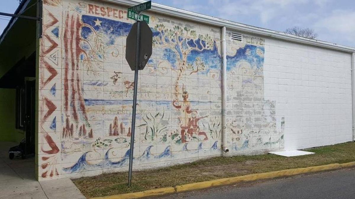 Owners of a building on the corner of Washington Avenue and Bowen Avenue painted over this 1990s mural by Chris Stebly in March. A grant will help the city replace it.