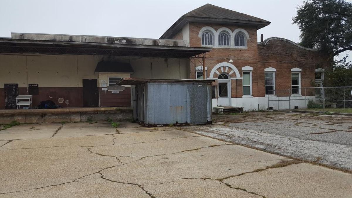 A newer portion of the historic Pascagoula Ice House building was demolished in 2016 after a fire. The original office building. with its distinctive architecture, at left, will be restored in a mixed-use development planned for the site.