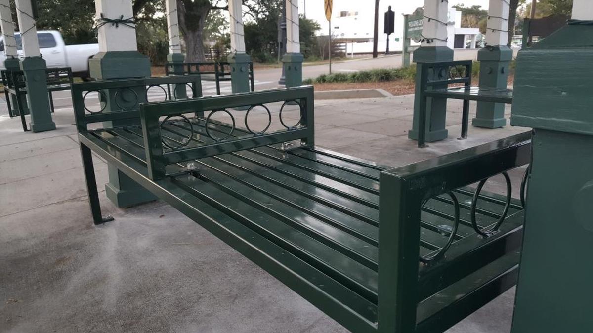 Ocean Springs has added raised dividers to its benches at the bus stop at the entrance to downtown to prevent people from sleeping on them.