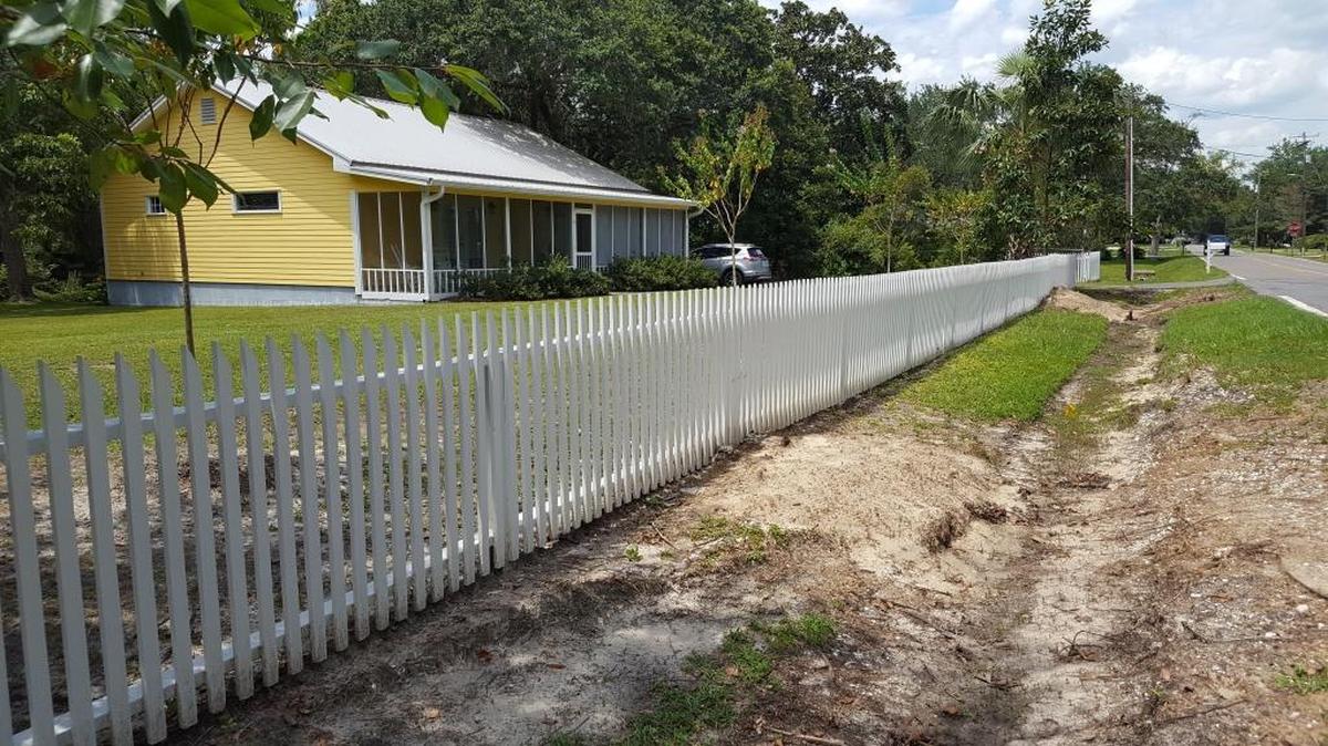 After: This is what the Brune yard on Holcomb Boulevard looks like without the large oaks along the fence that the city cut.