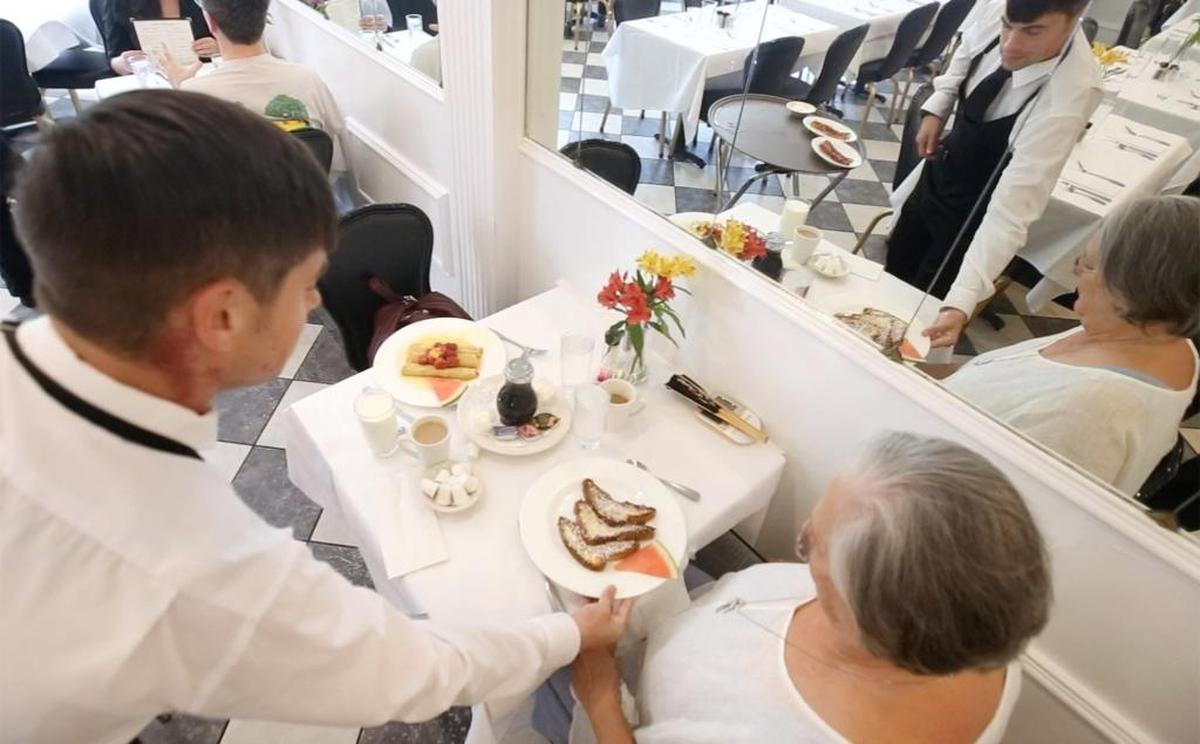 Jason Aldrich of Ocean Springs serves French toast to Carol Abbott of Vancleave at Phoenicia Gourmet in Ocean Springs on Monday, Sept. 25, 2017.