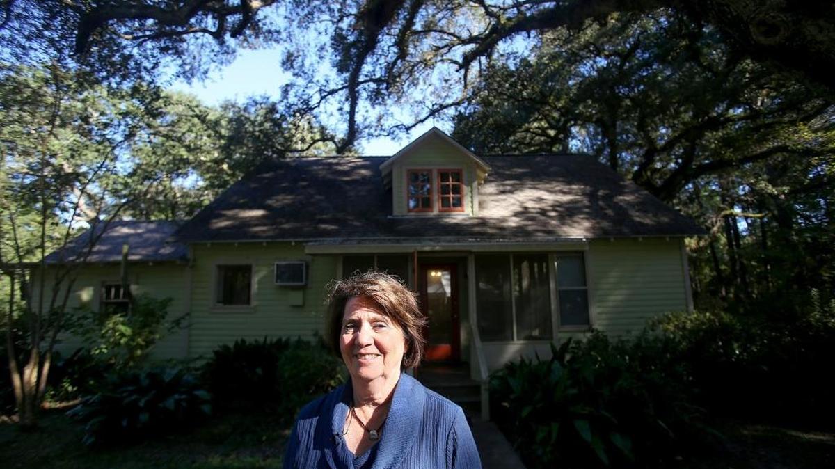 Judy Steckler, executive director of the Land Trust for the Mississippi Coastal Plain, pauses in front of the historic home on the Twelve Oaks property in Ocean Springs on Friday, October 21, 2016.