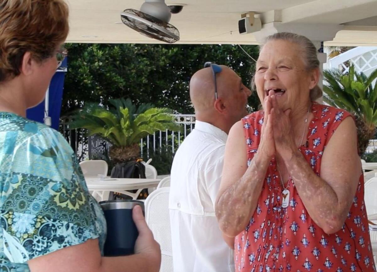 Jeanne ‘Granny’ Graeser of Waveland talks to Elizabeth Pate of Indianola, wife of Army veteran Jerry Pate, at the Palace Casino Marina in Biloxi before departing on a Soldier’s Angels boat cruise in May.