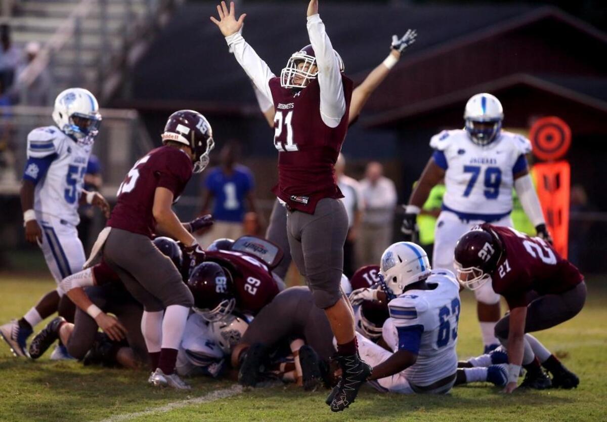 East Central’s Joel Reiser, center, celebrates after his team recovered a Jefferson Davis County rumble in September. East Central High in Hurley took a winning streak all the way to the state championships.