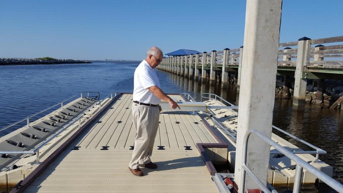 Engineer Ned Hogg, with Seymour Engineering, checks out the new kayak launch at the county’s Ocean Springs Harbor. The floating dock runs parallel to the county community pier at the harbor, at the east end of Front Beach in Ocean Springs.