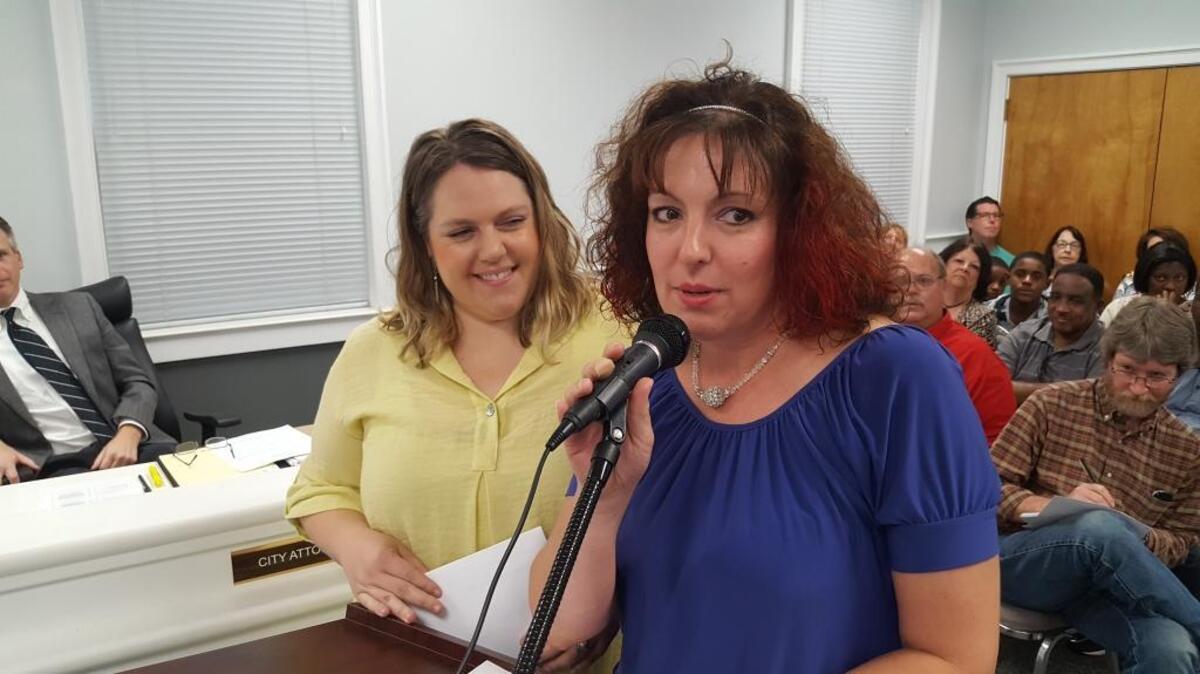 Elizabeth Feder-Hosey, left, and Heather Eason approach the Ocean Springs Board of Aldermen with the proposal to form an all-women night parade.
