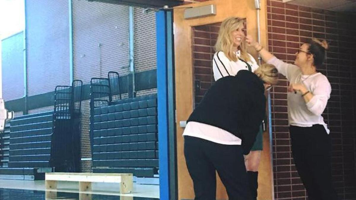 Pascagoula native and NFL referee Sarah Thomas poses in front of a gymnasium named after her in Pascagoula for a photo shoot with Marie Claire and Elle magazines on Friday, Feb. 10, 2017.