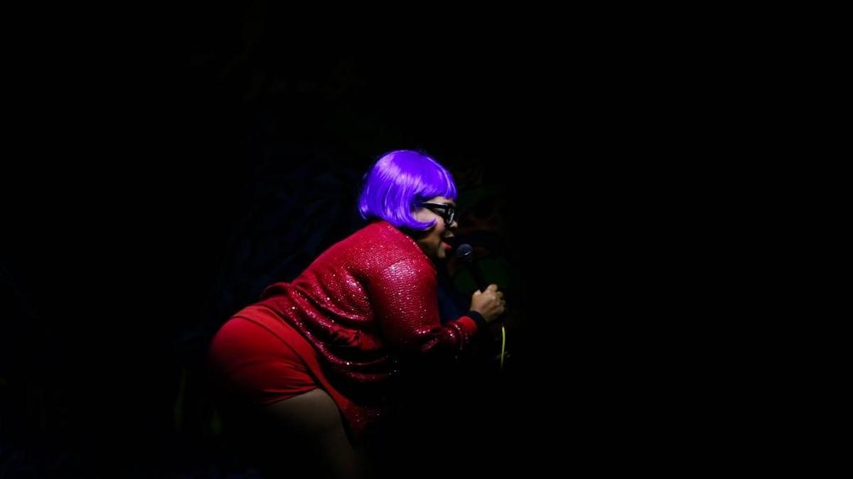 She She Magique, a member of Sultry Southern Sirens, performs a burledque number during Naughty 90's Night at the Juke Joint on Saturday, Dec. 3, 2016.