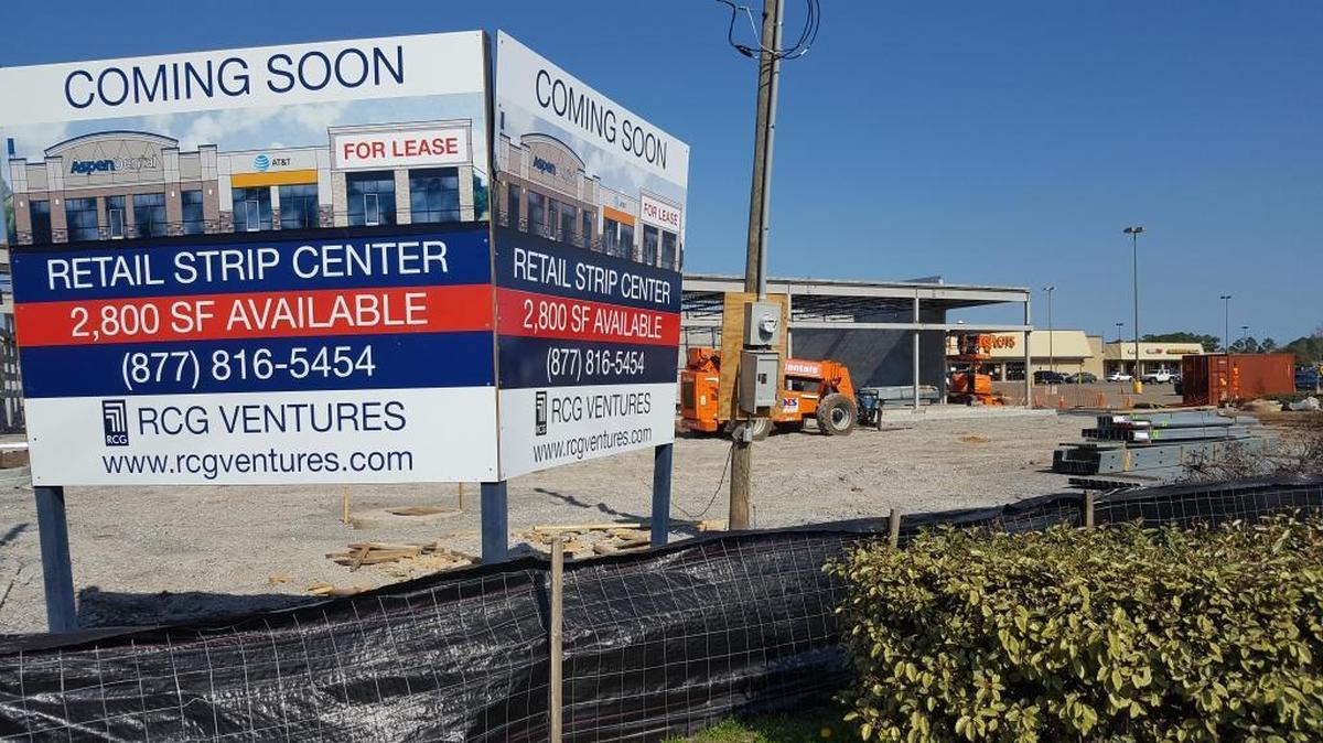 Pascagoula is getting a new strip mall that is already two-thirds filled and is expected to be complete by May. The sign at left contains an artist’s rendering of the mall.
