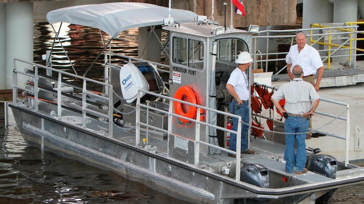 This is one of the oil skimming boats built by Trinity Offshore shipyard in Gulfport and delivered to Mississippi, paid for with BP oil spill money. On board in this photo are officials will Trinity and US Environmental, which operated the boats during the spill cleanup. The boats were designed to hold 1,200 gallons of oil.