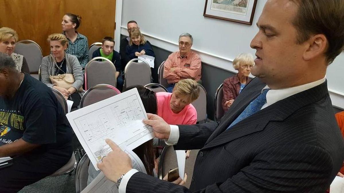Scott Walker shows plans for a sprinkler system in his East Beach home at a Board of Aldermen meeting Feb. 22, which he hoped would help him secure a permit to run a bed-and-breakfast in his Ocean Springs home. The board denied Walker’s permit request Tuesday.