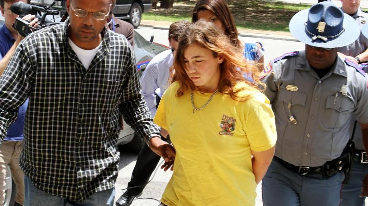 Brandy Nicole Williams is led into the George County Justice Court building for her initial appearance on a capital murder charge in the 2010 death of George County Sheriff Garry Welford.