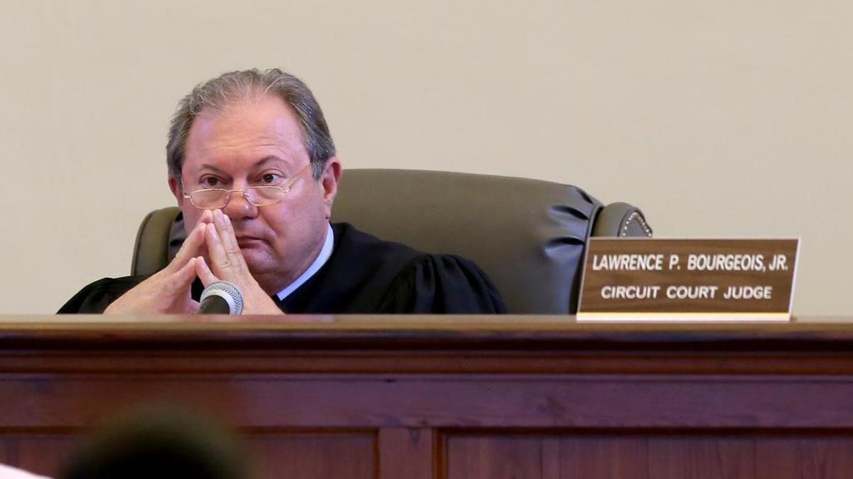 Judge Lawrence Bourgeois listens to opening arguments in the teacher-student sex scandal trial of Leslie Danielle DeWitt.