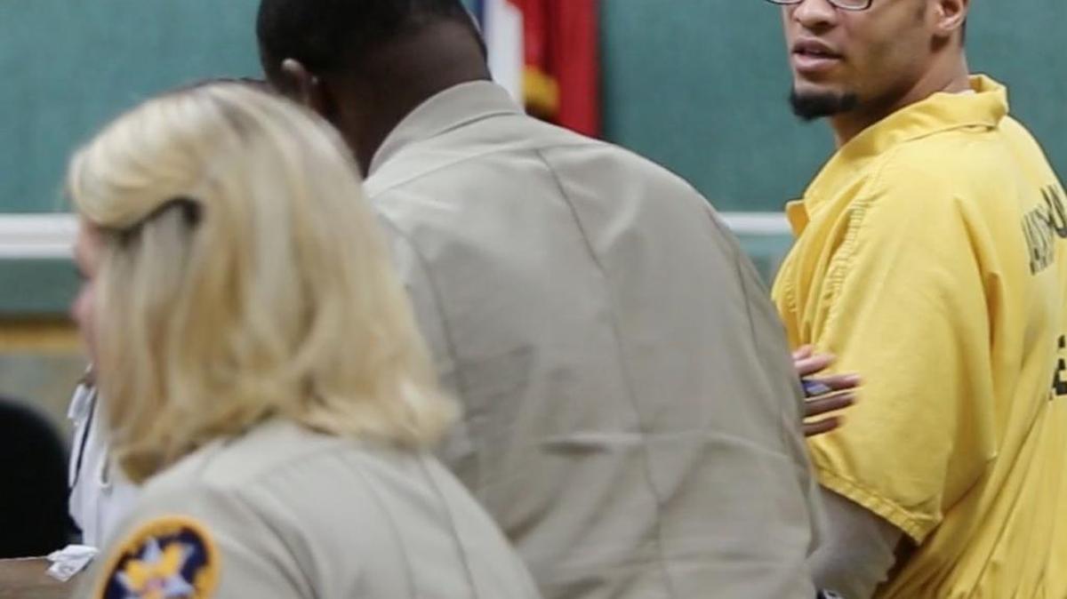 Dwanya Hickerson looks back to his mother in Jackson County Circuit Court in Pascagoula on Thursday, July 20, 2017 after pleading guilty to the robbery and killing of a transgender nurse from Hattiesburg in July 2016.
