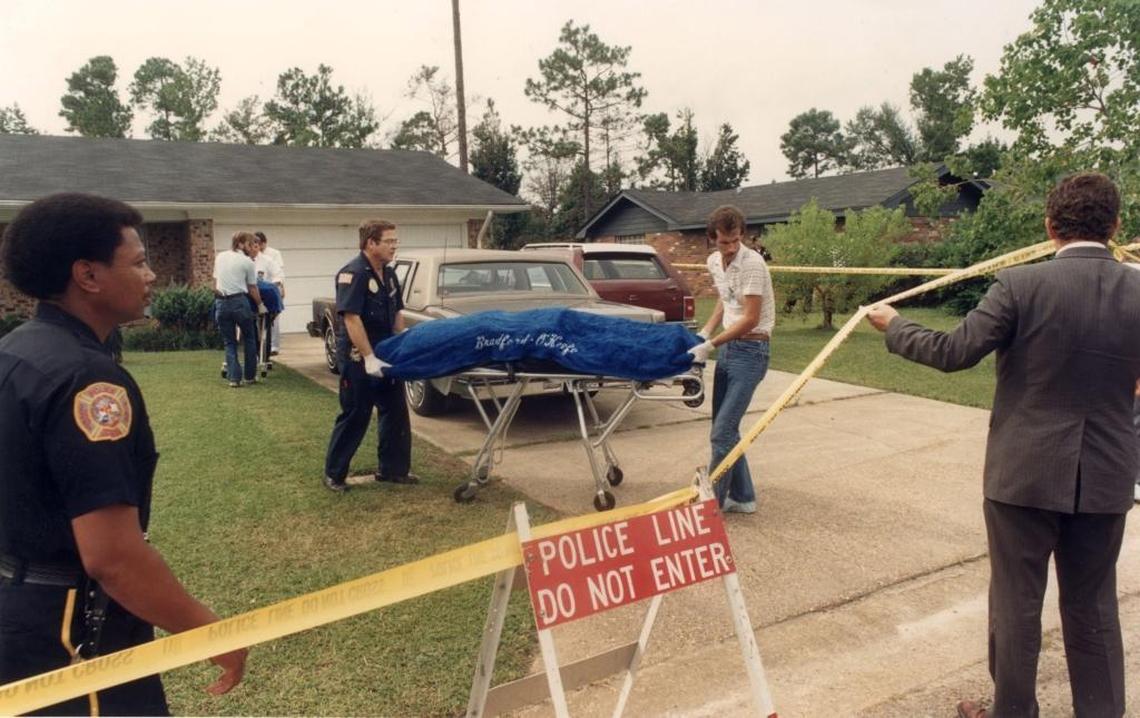 The bodies of Vincent and Margaret Sherry are removed from their Biloxi home on September 16. 1987, by Robert Burris, center left, crime scene investigator for the Biloxi Police Department, and Harrison County Coroner Gary Hargrove. It was one of the high-profile urders Hargrove investigated in his more than 20 years as coroner.