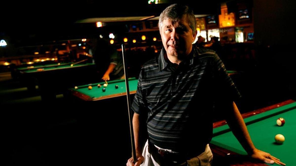 Mike Surber, a renowned pocket billiards player, is seen in Skeeter's Billiards on Tegarden Road in Gulfport in this file photo taken in 2008. The Ocean Springs resident was found later stabbed to death in the back in his home. The FBI has taken the lead in the cold cold case investigation.
