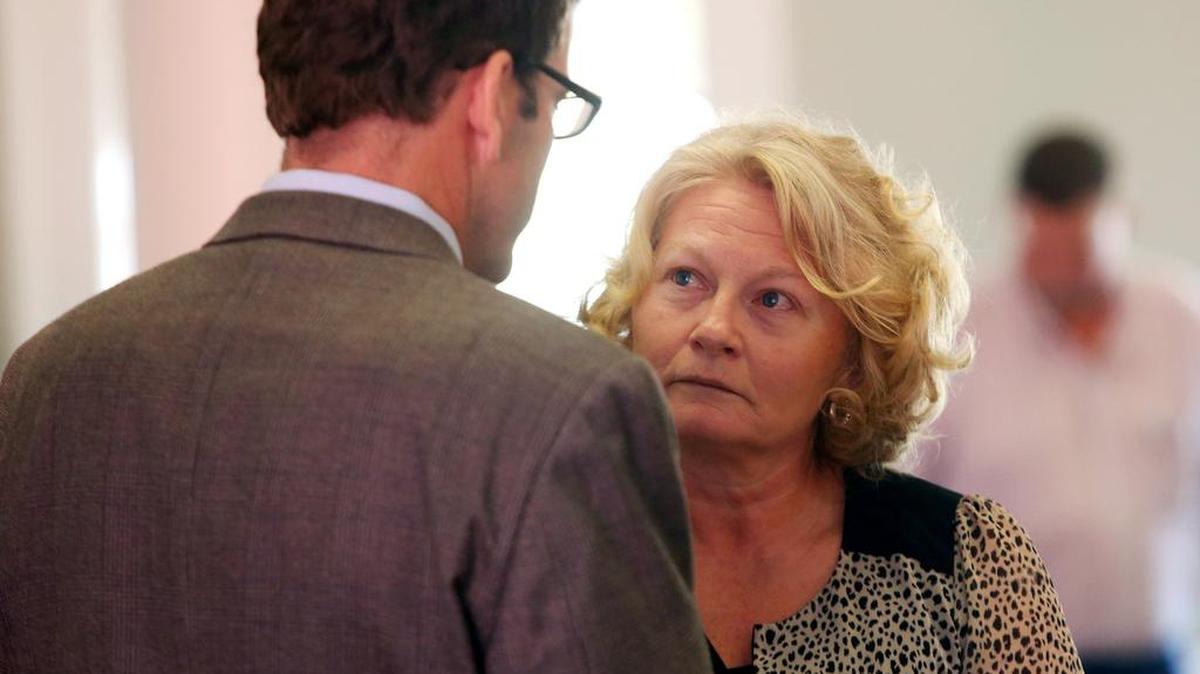 Former George County jail nurse Carmon Brannan speaks to her former attorney, Calvin Taylor.