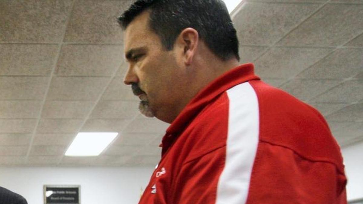 Joseph Davis Jr., is escorted from the Biloxi School Board meeting by Paul Cannette of the Biloxi Schools Campus Police on Tuesday night, Feb. 18, 2009. Cannette has been indicted by the state Auditor’s Office on charges of embezzlement.