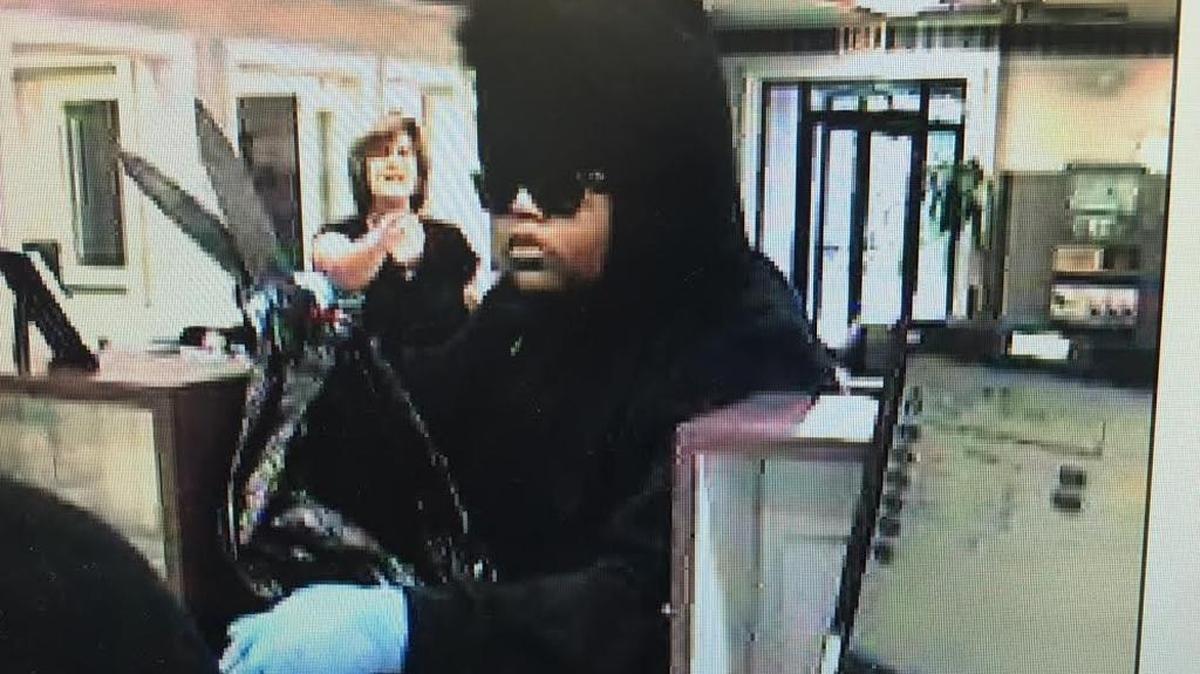 Police say this women with two knives robbed the Hancock Bank in Ocean Springs on Wednesday.