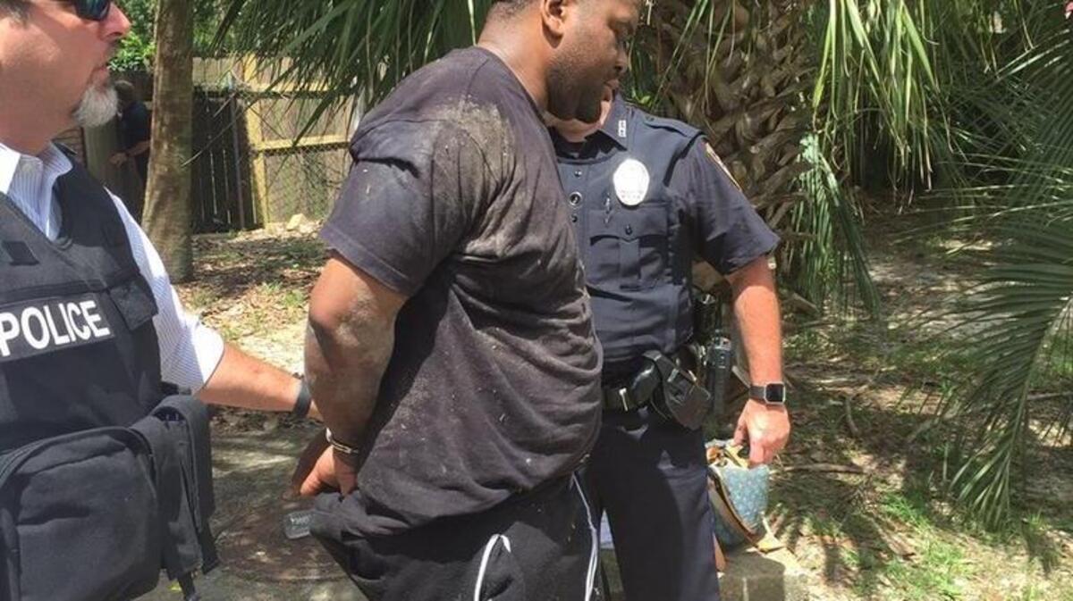 Marcus Hosey is led into custody by Gulport police Thursday morning.