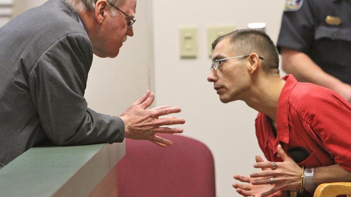 Stephen Virgil McGilberry talks to with his attorney, John Kerr, before appearing in Jackson County Circuit Court in Pascagoula on Friday, July 17, 2015