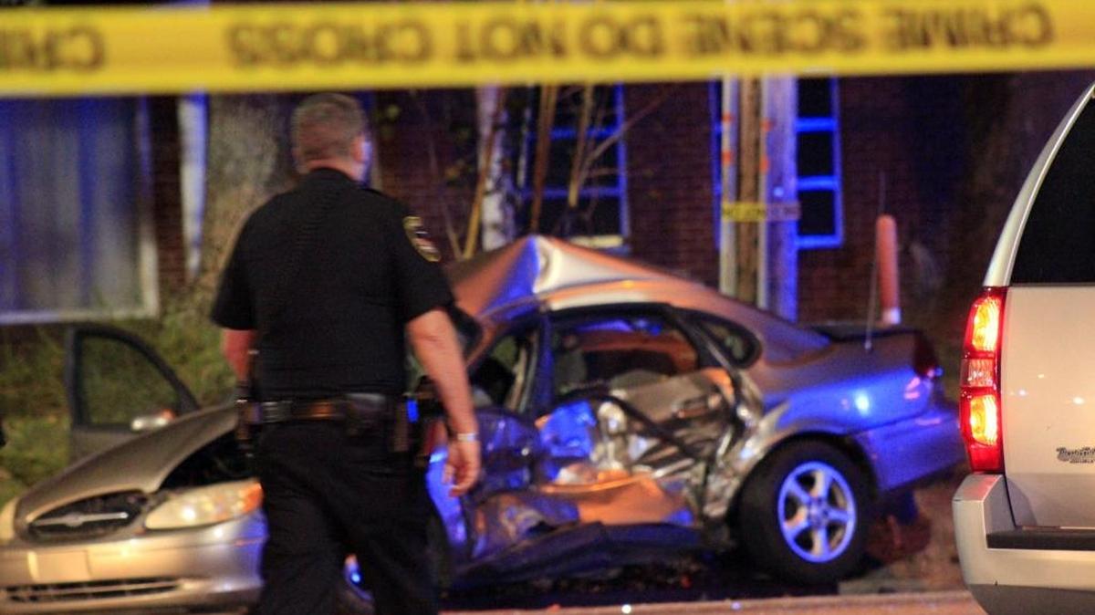 A crashed car can be seen at the scene of a shooting at Popp’s Ferry and Lamey Bridge roads on Monday night, Oct. 24, 2016.