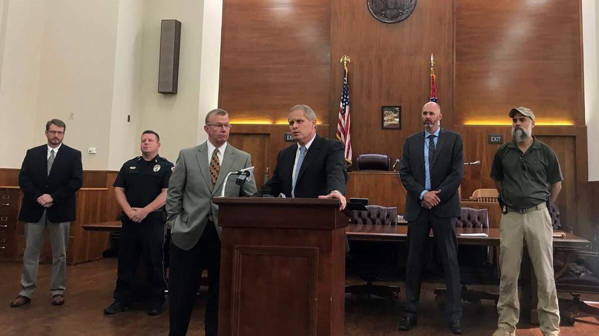 District Attorney Tony Lawrence speaks at a news conference Wednesday about a fatal shooting. From left are Investigator Jason Smith, Moss Point Police Chief Brandon Ashley, Jackson County Sheriff Mike Ezell, FBI Supervisory Agent Richard Boswell and FBI Agent Jerome Lorrain.